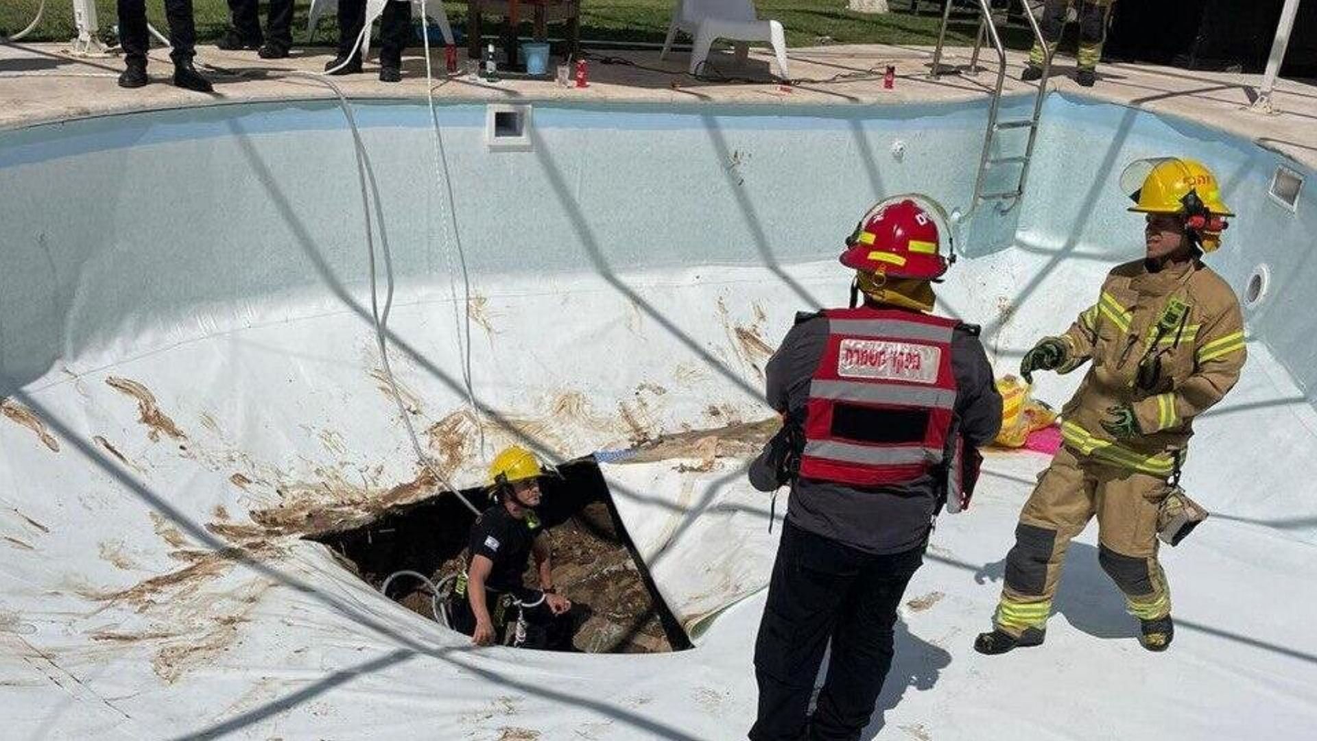 A man passed away after getting swallowed by a large sinkhole that formed abruptly in a swimming pool. (Image via @neontaster/Twitter)