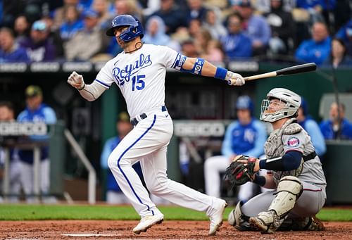 Kansas City Royals Whit Merrifield hits a double against the Minnesota Twins.