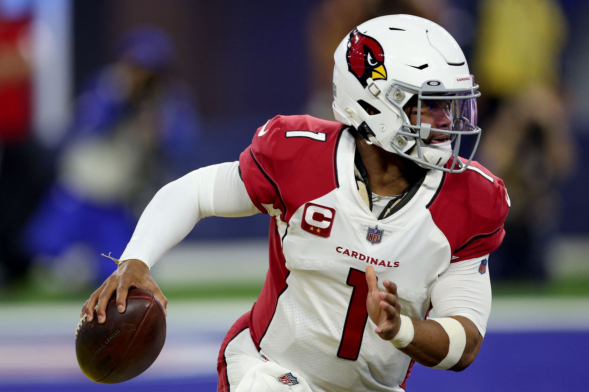 Arizona Cardinals quarterback Kyler Murray scrambles with the ball