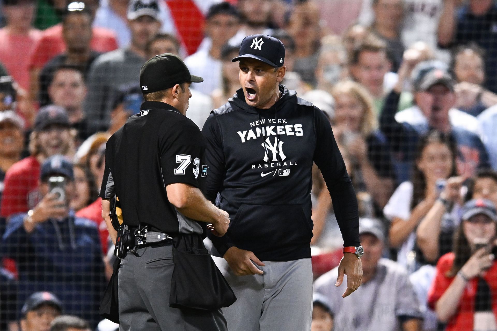 Manager Aaron Boone of the New York Yankees yells at home plate umpire Tripp Gibson