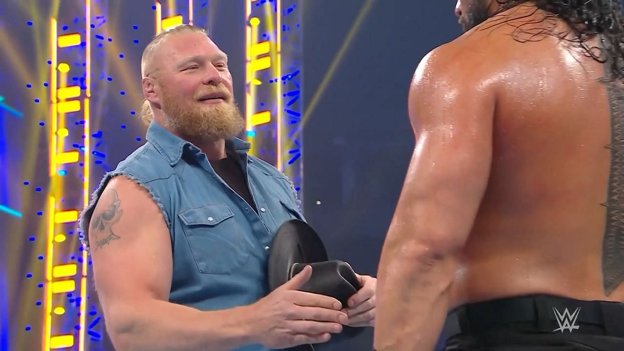 Lesnar returns and offers a handshake to Roman Reigns