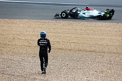 George Russell finds it 'very frustrating' to be stopped by the FIA from resuming the 2022 F1 British GP after leaving car to check on Zhou Guanyu