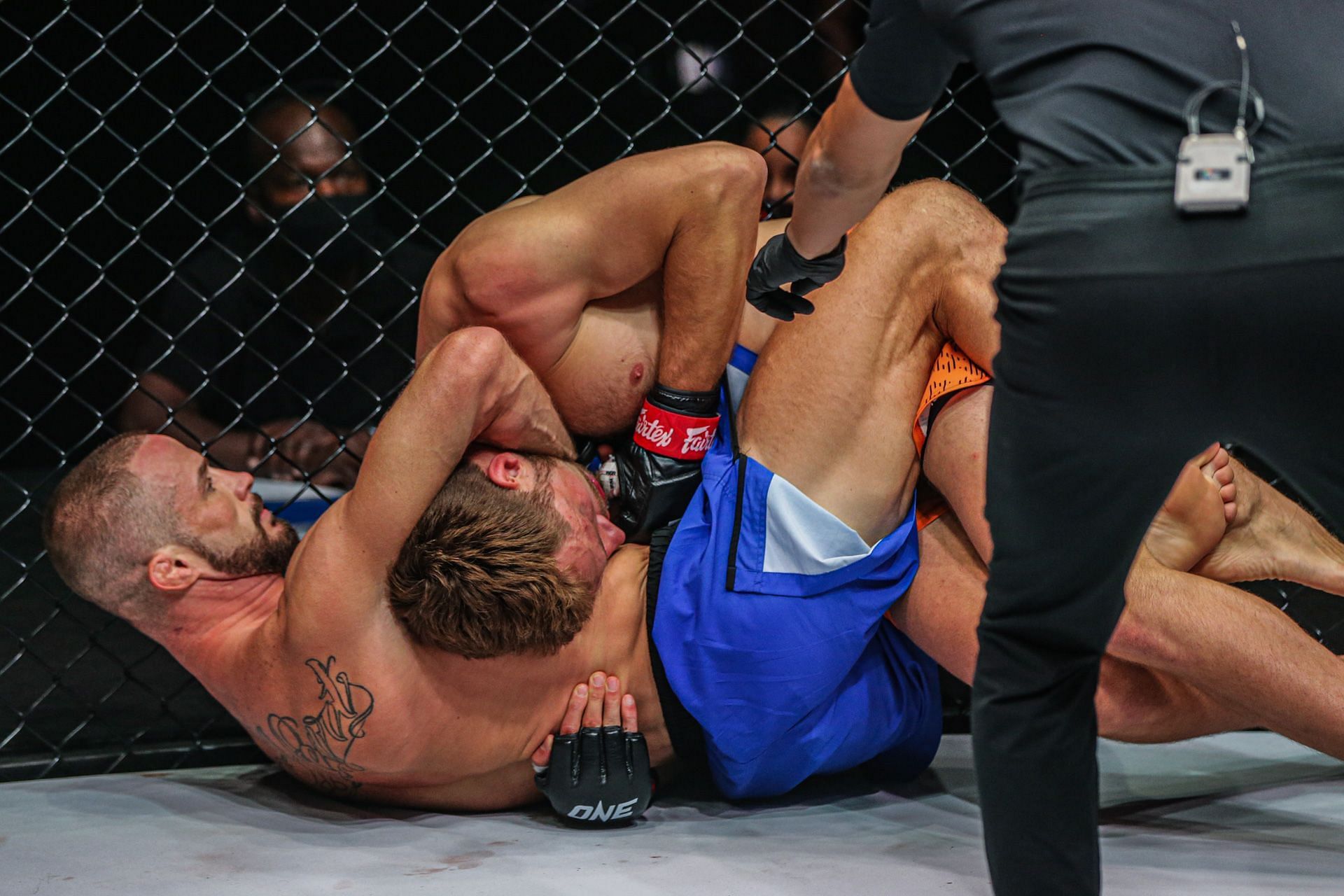 Vitaly Bigdash put Reinier de Ridder in a guillotine choke early in the fight. (Image courtesy of ONE)