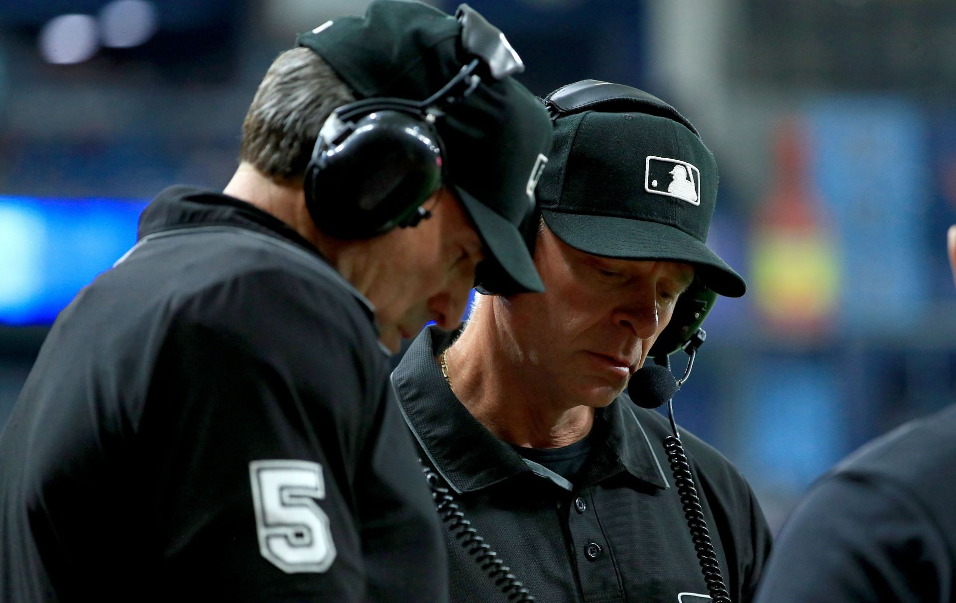 Umpires review a call during a Boston Red Sox v Tampa Bay Rays game.