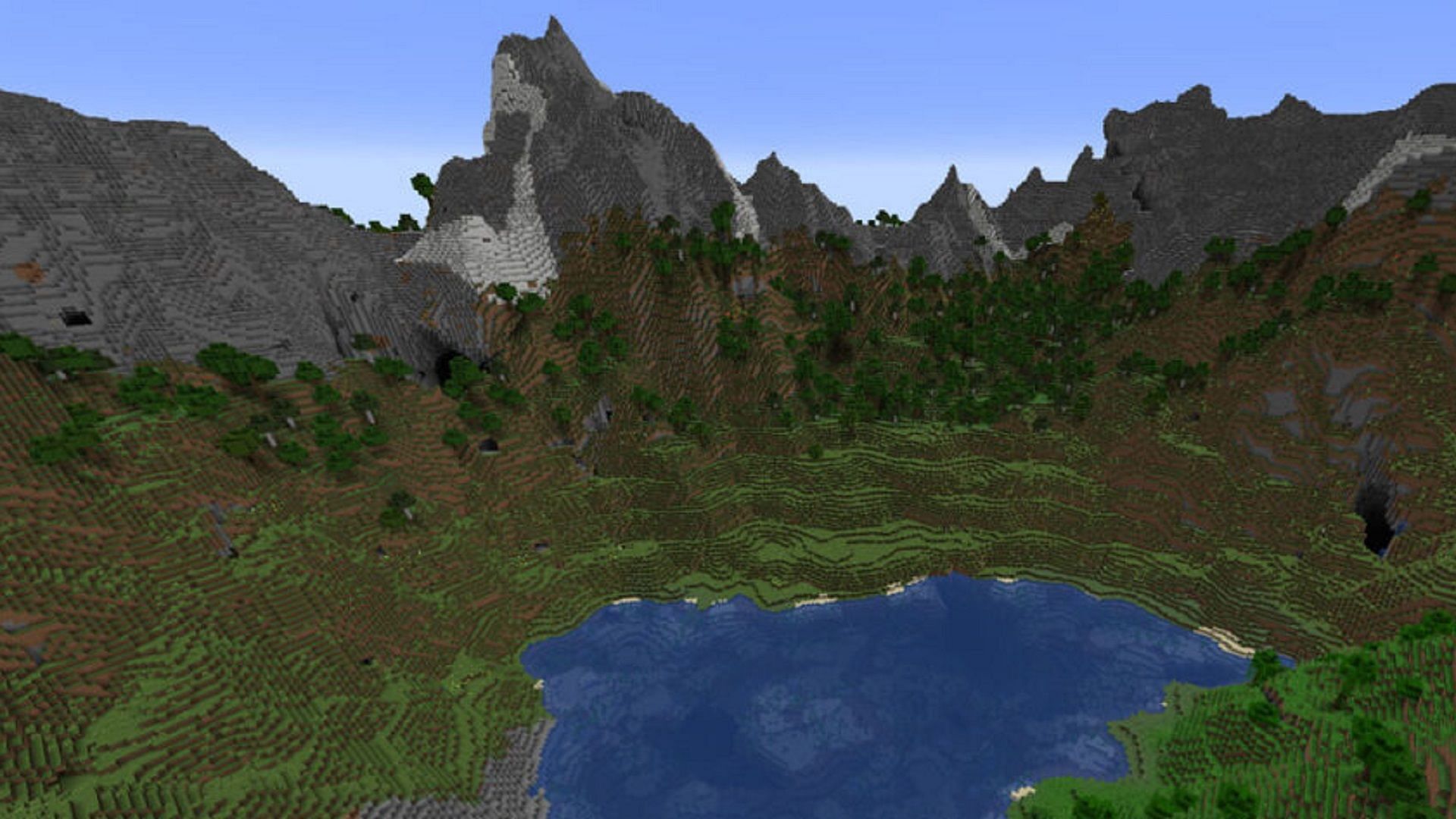 A silent mountain valley, complete with a small lake (Image via Mojang)