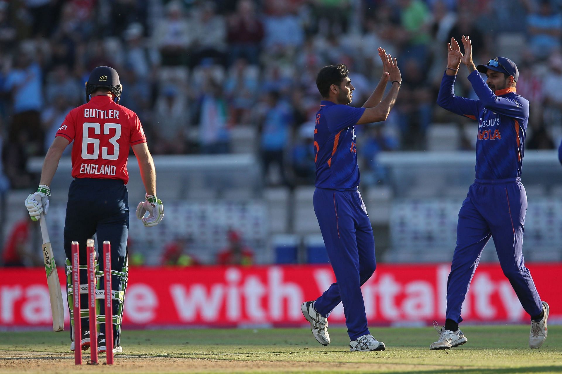 Bhuvneshwar Kumar celebrates after taking the wicket of Jos Buttler. Pic: Getty Images