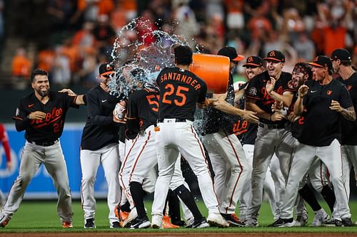 Trey Mancini of the Baltimore Orioles celebrates with teammates after hitting a walk-off single.