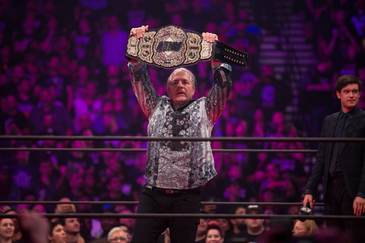 The Hitman showing the AEW World Championship off to the crowd.