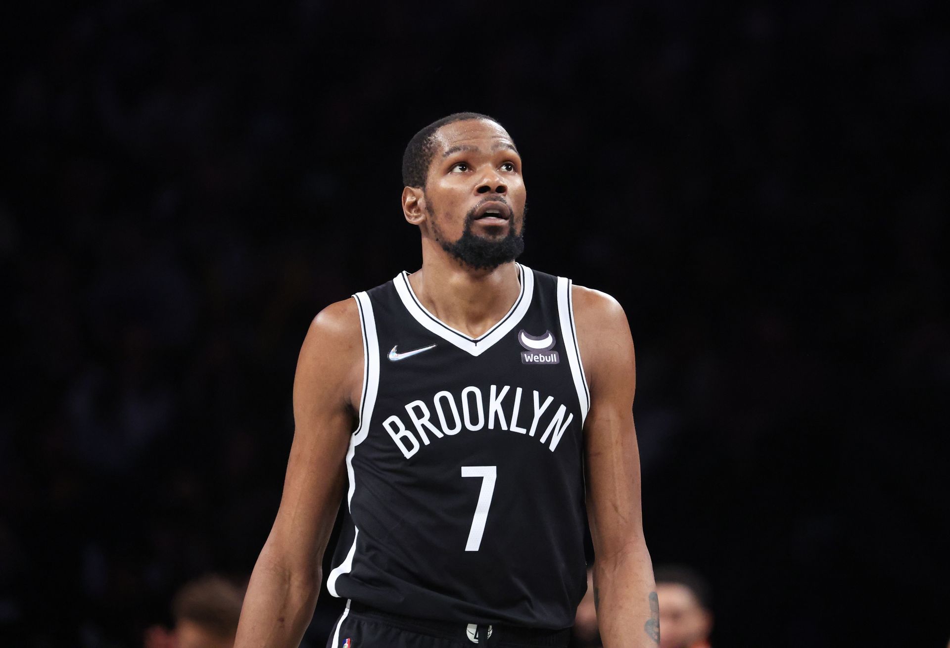 Kevin Durant #7 of the Brooklyn Nets looks on against the Boston Celtics during Game Three of the Eastern Conference First Round NBA Playoffs at Barclays Center on April 23, 2022 in New York City.