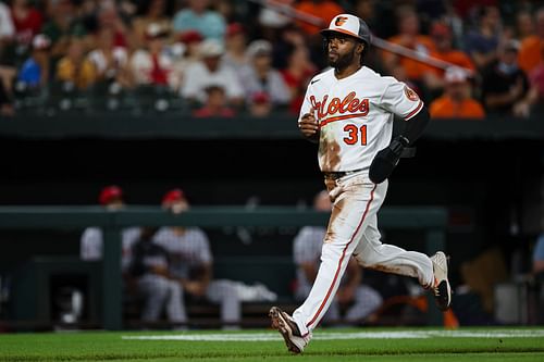 Baltimore Oriole Cedric Mullins scores against the Los Angeles Angels.