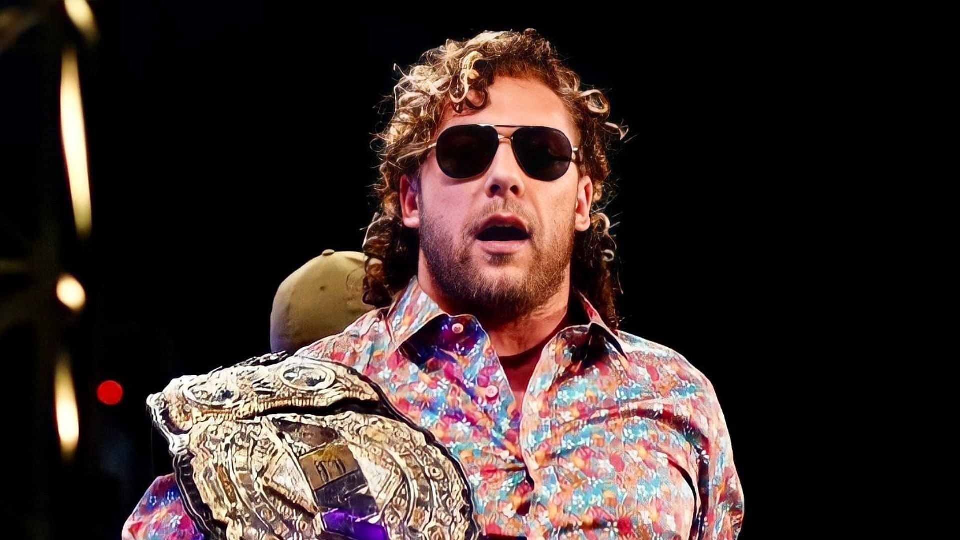 Kenny Omega with the AEW World Championship in 2021