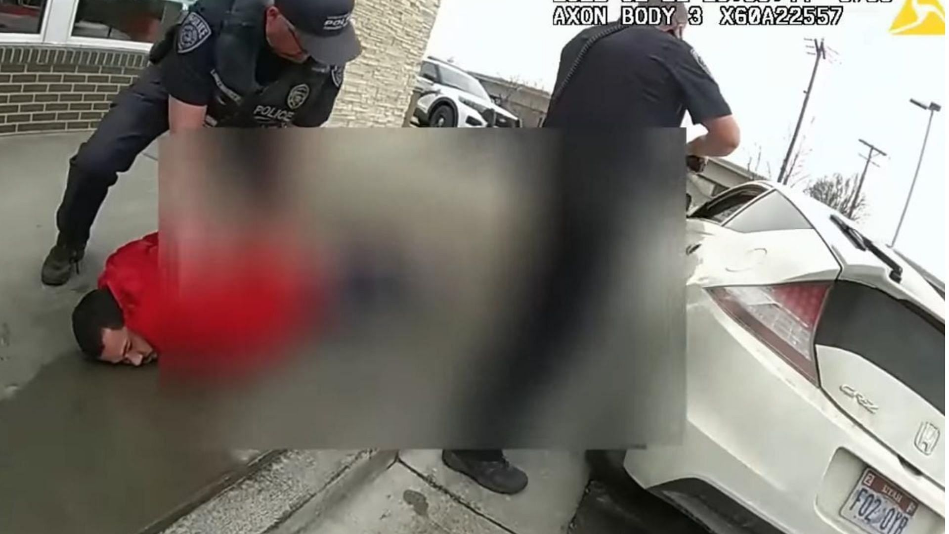 Bodycam footage shows a four-year-child point a gun at police officers while they were arresting his father (Image via Law&amp;Crime Network / Youtube)