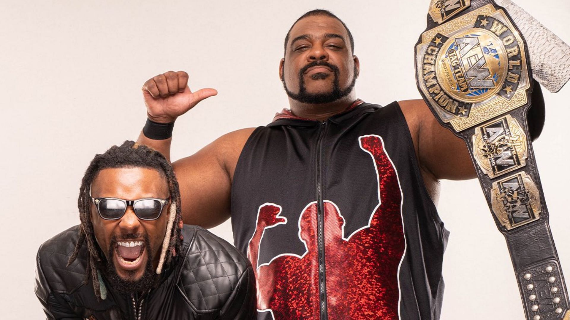 Keith Lee and Swerve Strickland with the AEW Tag Team Championships