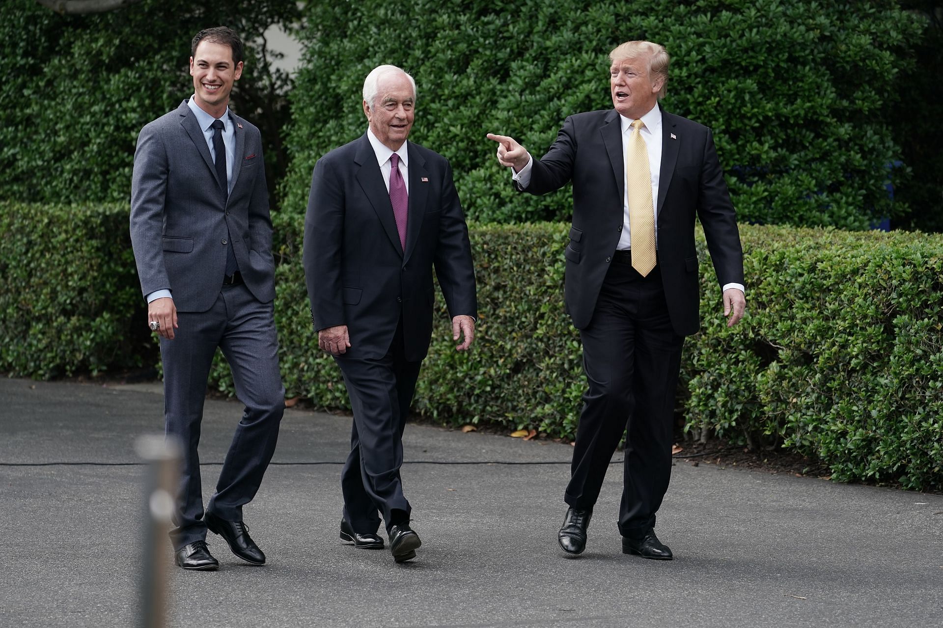 (L-R) Joey Logano, Team Penske owner Roger Penske, and former U.S. President Donald Trump arrive for a ceremony celebrating Logano&#039;s victory on the South Lawn of the White House on April 30, 2019. in Washington, DC (Photo by Chip Somodevilla/Getty Images)