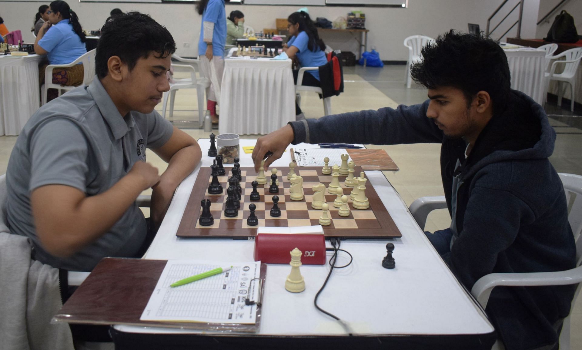 Srihari L of Puducherry (R) making a move against FM Ayush Sharma of Madhya Pradesh during the 10th round match in Pune on Tuesday. (Pic credit: AICF)