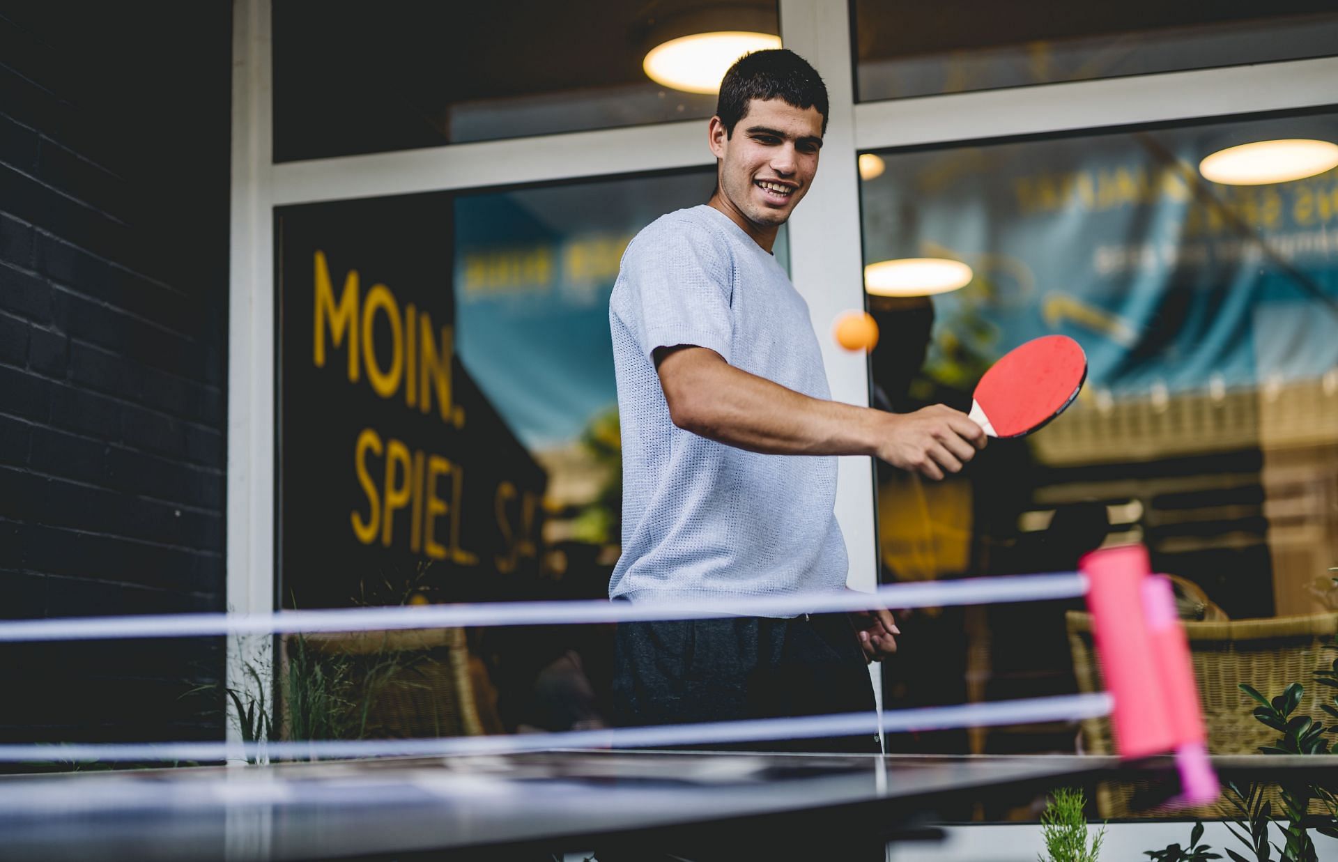 Carlos Alcaraz tries his hand at table tennis on the sidelines of the Hamburg European Open