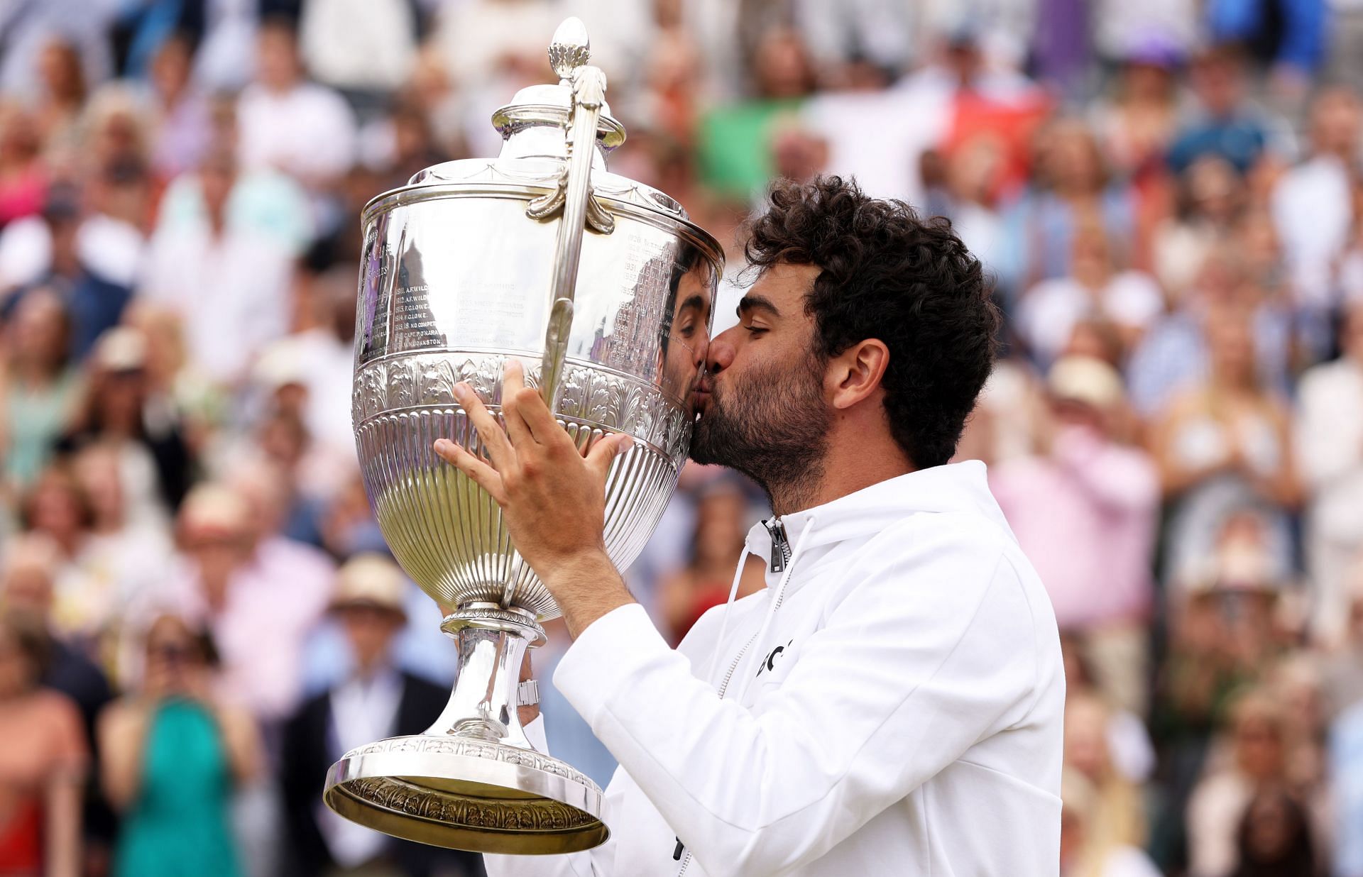 Matteo Berrettini kisses the trophy after winning the Cinch Championships