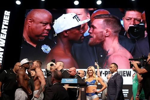 The Floyd Mayweather Jr. (L) vs. Conor McGregor (R) weigh-in