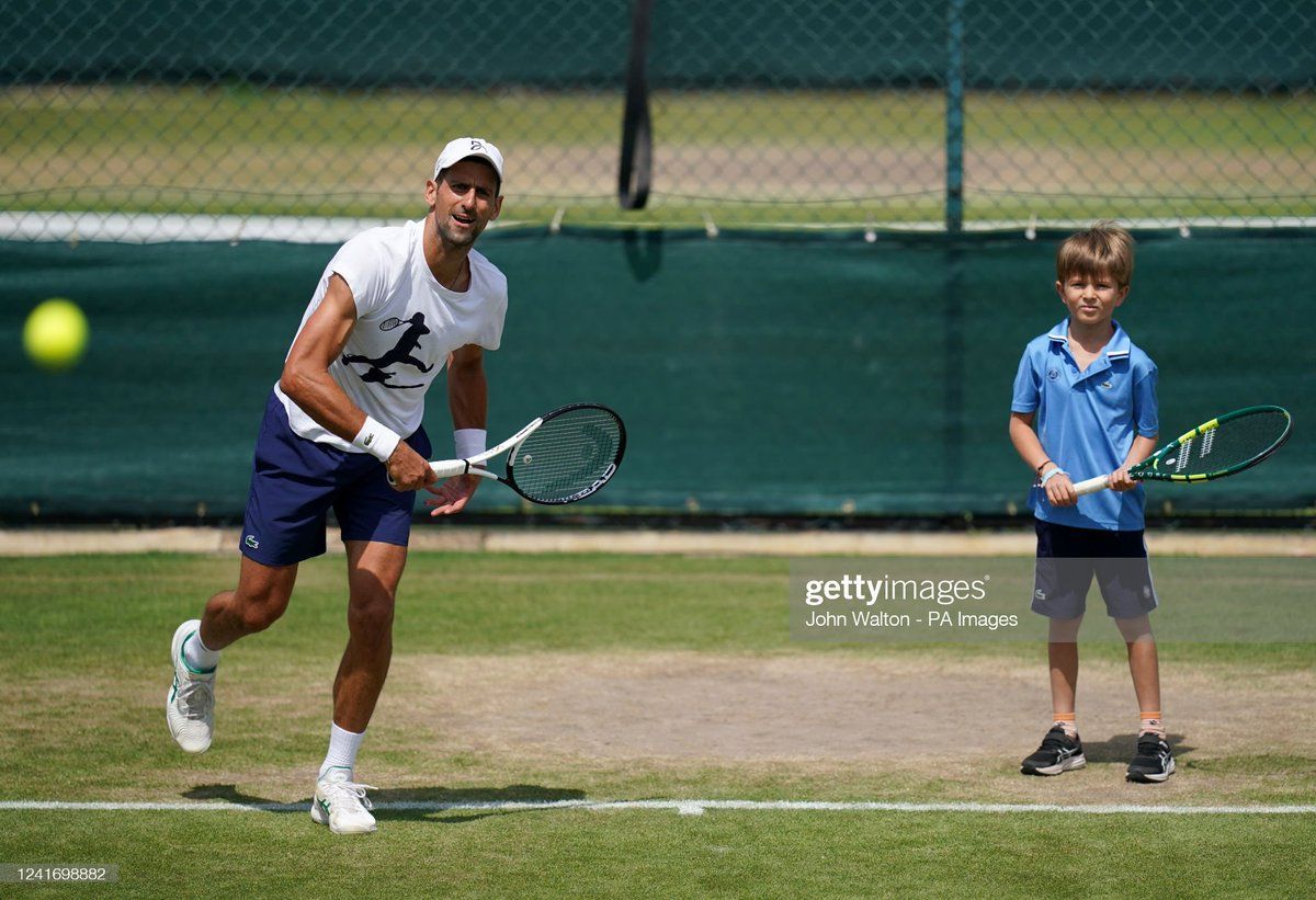 Stefan Djokovic eargerly watching his father practice