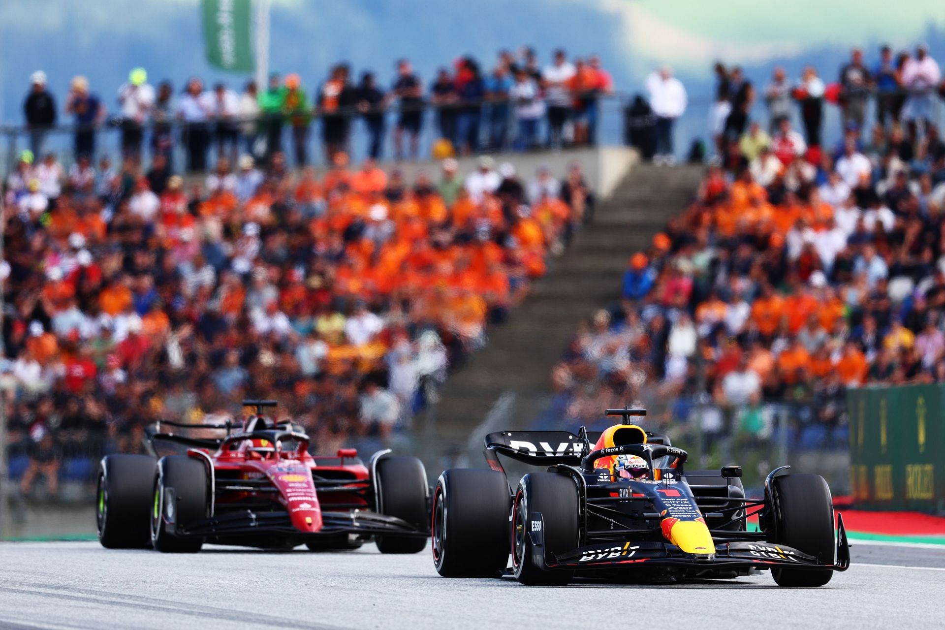 Max Verstappen driving the (#1) Oracle Red Bull Racing RB18 leads Charles Leclerc driving the (#16) Ferrari F1-75 during the F1 Grand Prix of Austria at Red Bull Ring on July 10, 2022, in Spielberg, Austria (Photo by Clive Rose/Getty Images)