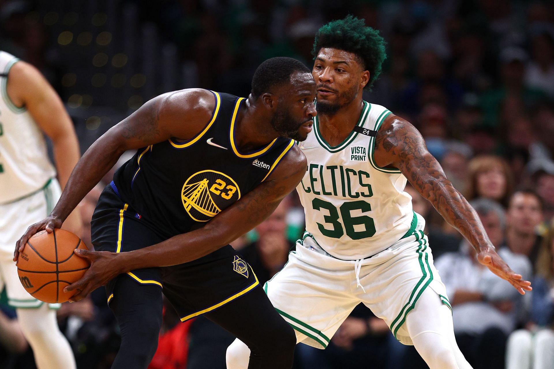 Draymond Green of the Golden State Warriors and Marcus Smart of the Boston Celtics