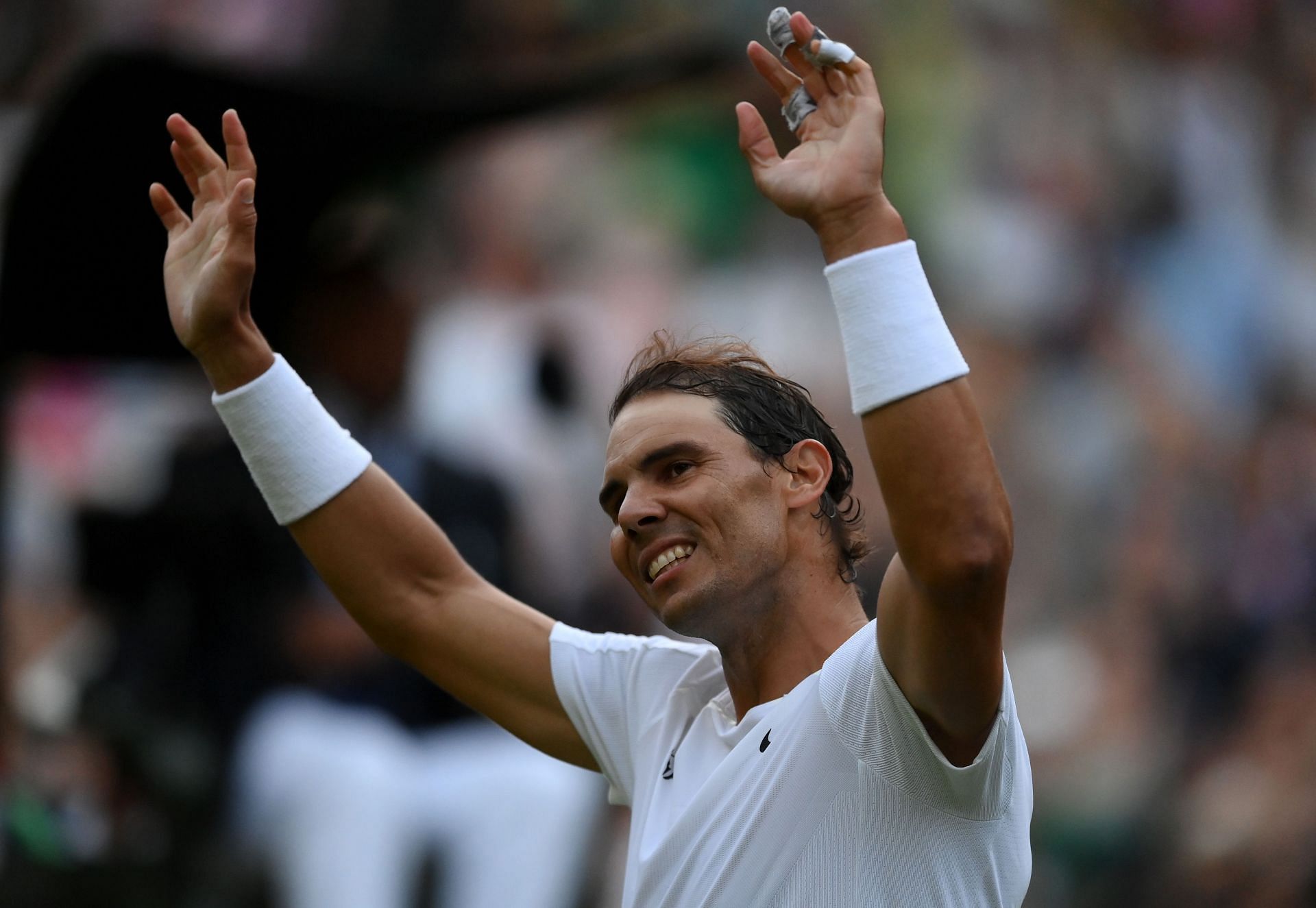 Rafael Nadal waves to the crowd on Day Eight: The Championships - Wimbledon 2022