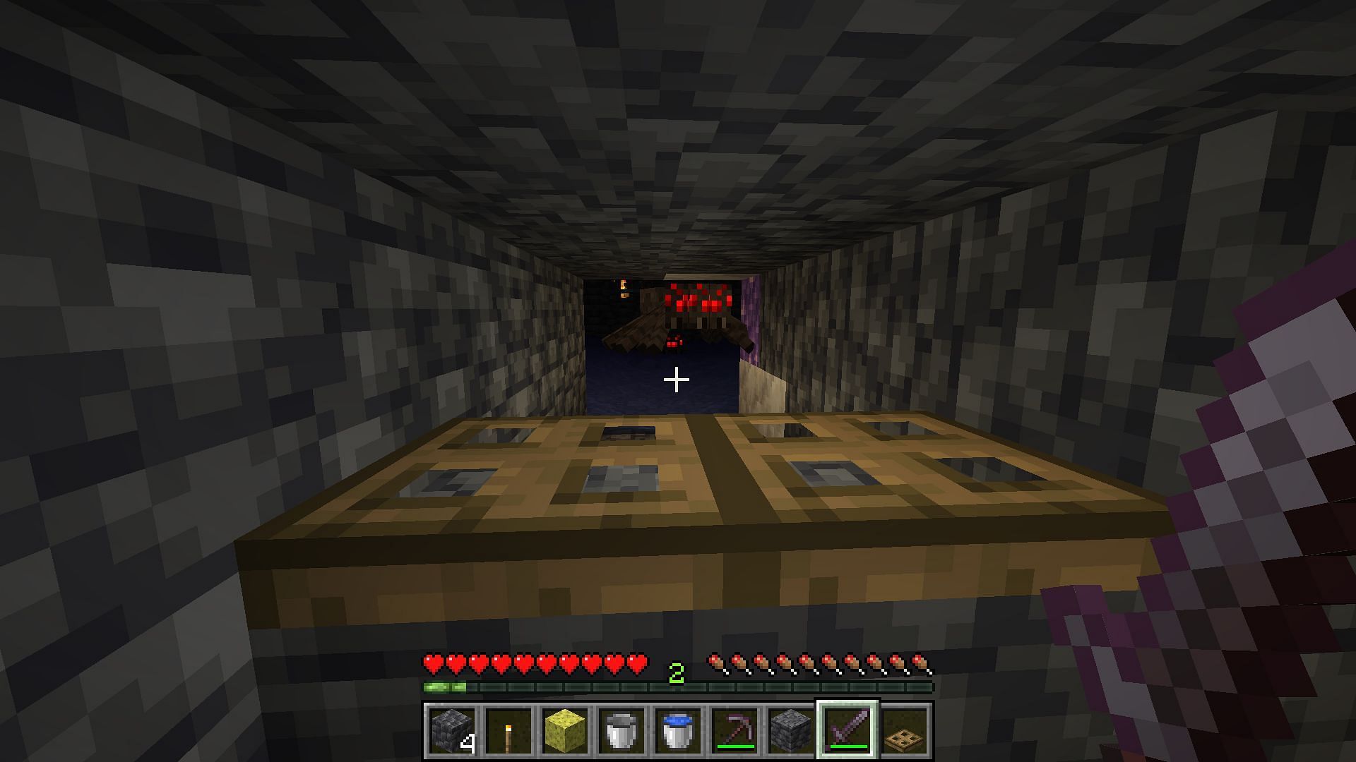Spider spawner turned into a simple XP farm area (Image via Minecraft)