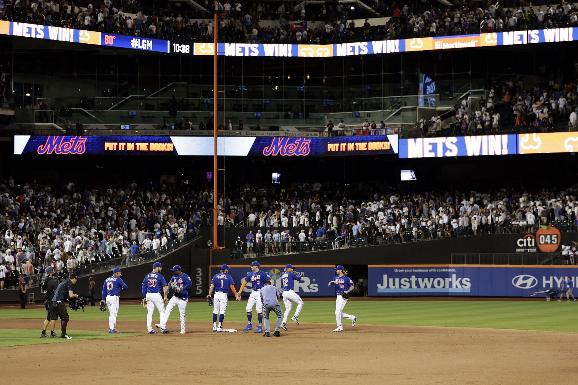 The New York Mets celebrate after defeating the New York Yankees at Citi Field on July 26.