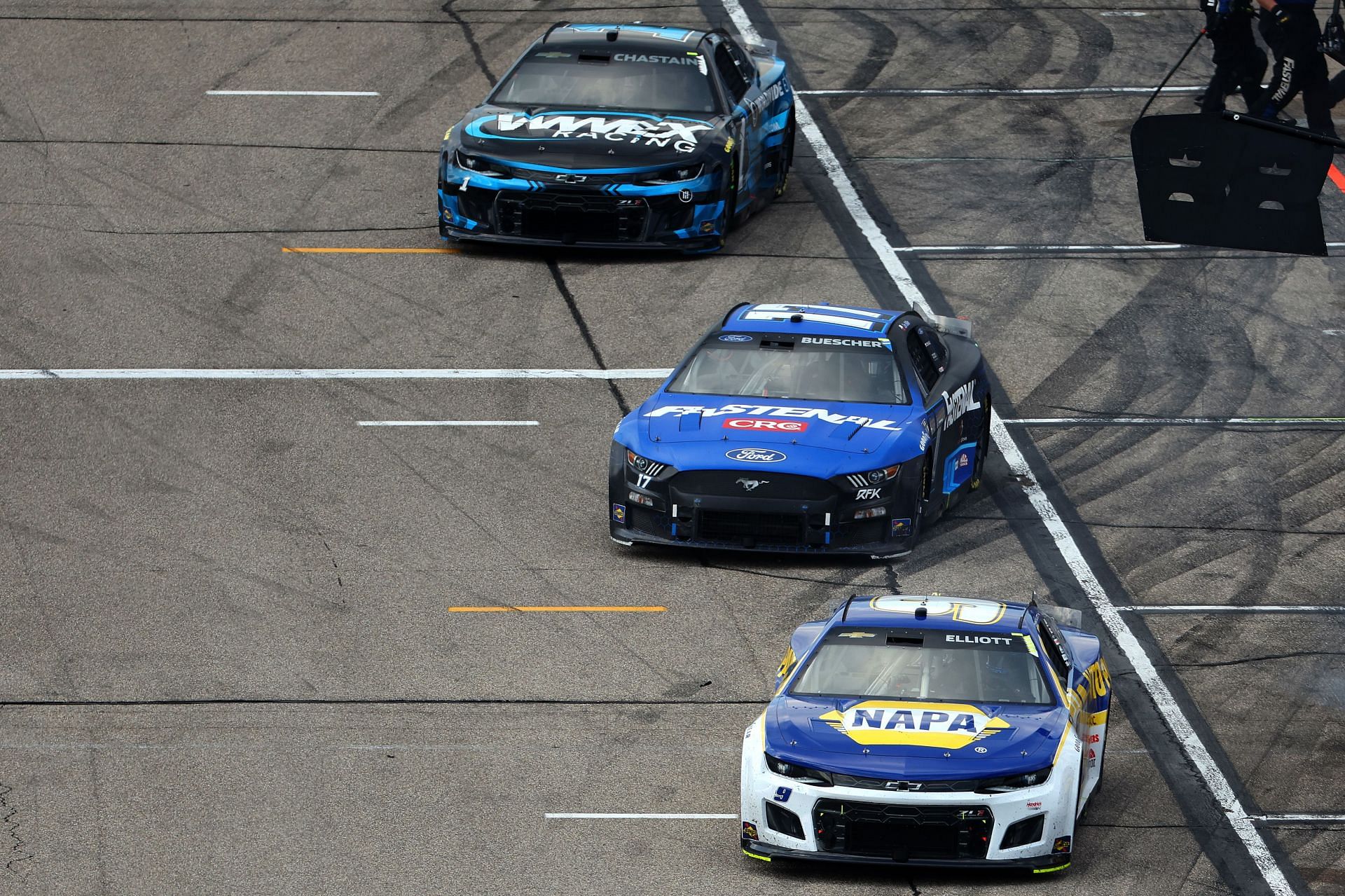 Cars exiting pit road during the 2022 NASCAR Cup Series Ambetter 301 at New Hampshire Motor Speedway in Loudon, New Hampshire (Photo by James Gilbert/Getty Images)