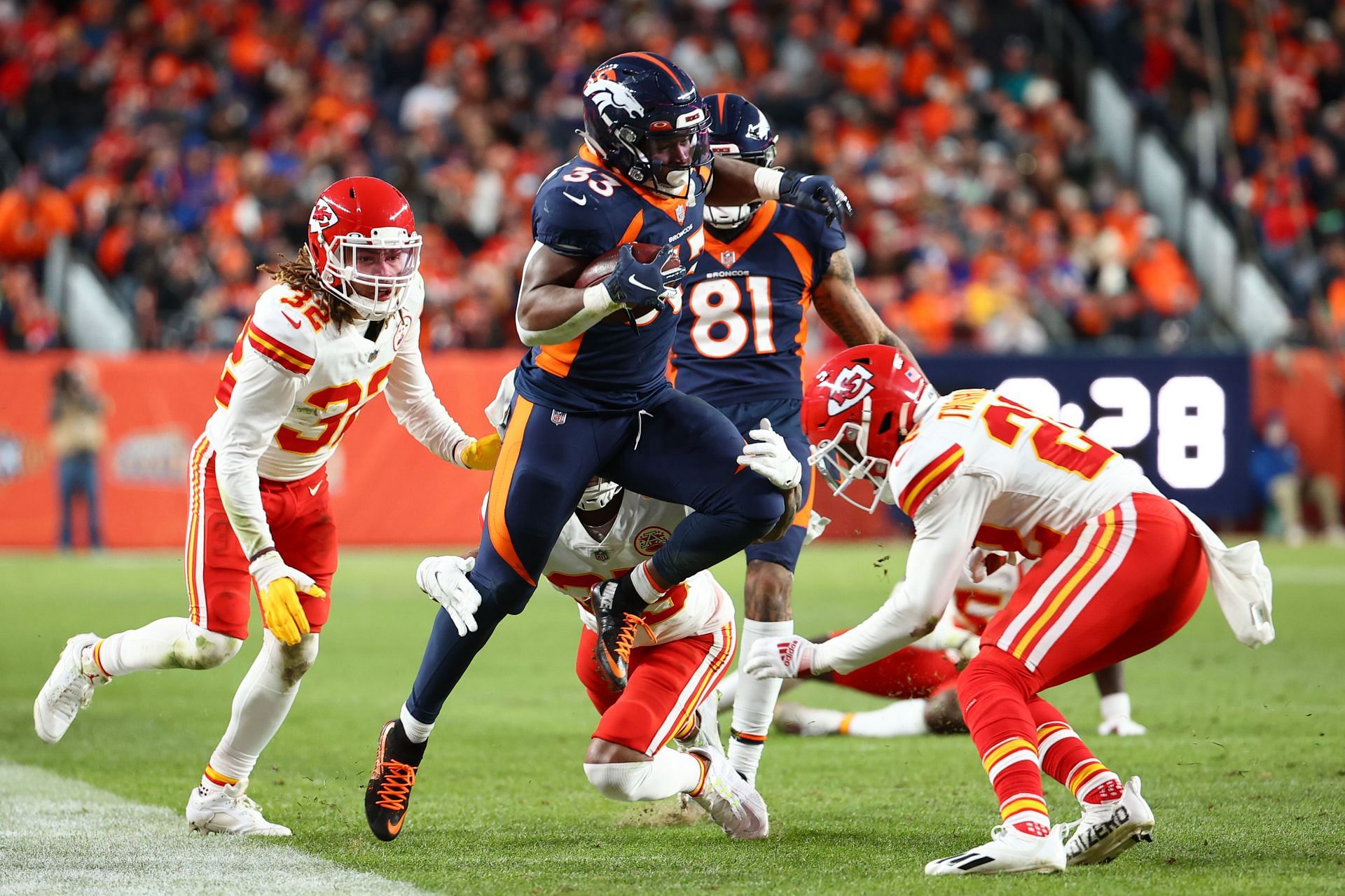 Running back Javonte Williams of the Denver Broncos runs with the