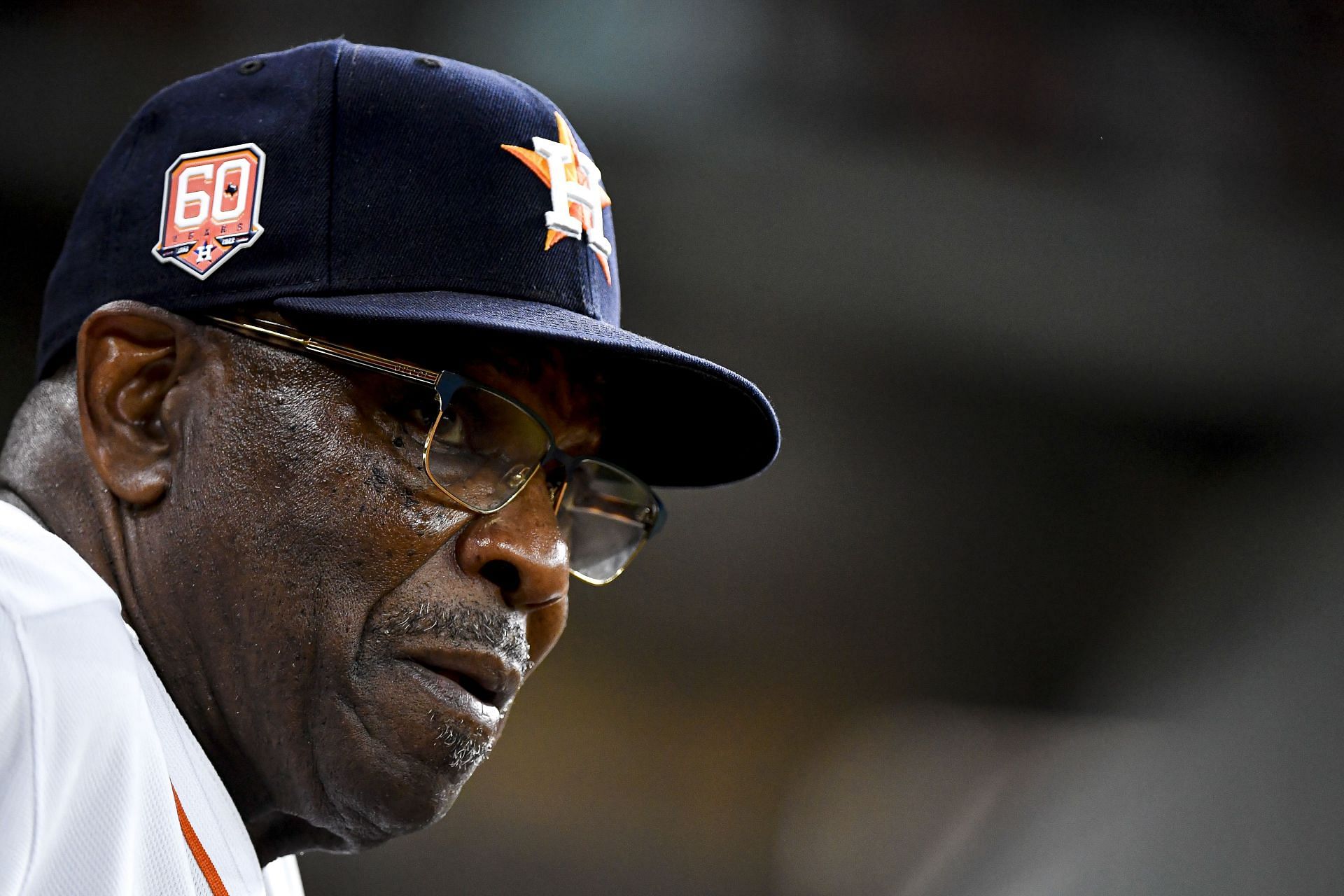 Dusty Baker Jr. #12 of the Houston Astros stands in the dugout during the second inning against the Kansas City Royals.