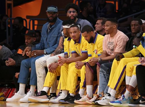 The LA Lakers bench, with LeBron James, left, Anthony Davis and Russell Westbrook not in uniform