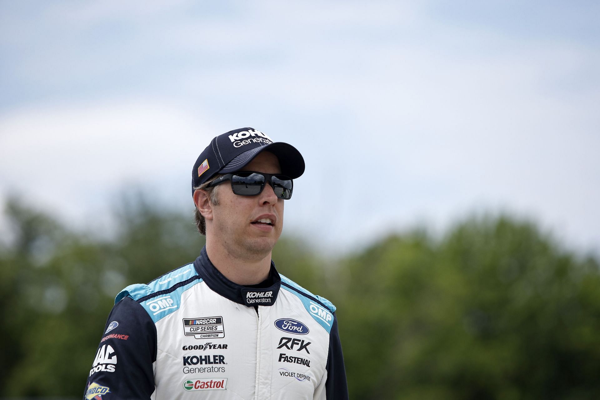 Brad Keselowski walks the grid prior to the NASCAR Cup Series Kwik Trip 250 at Road America