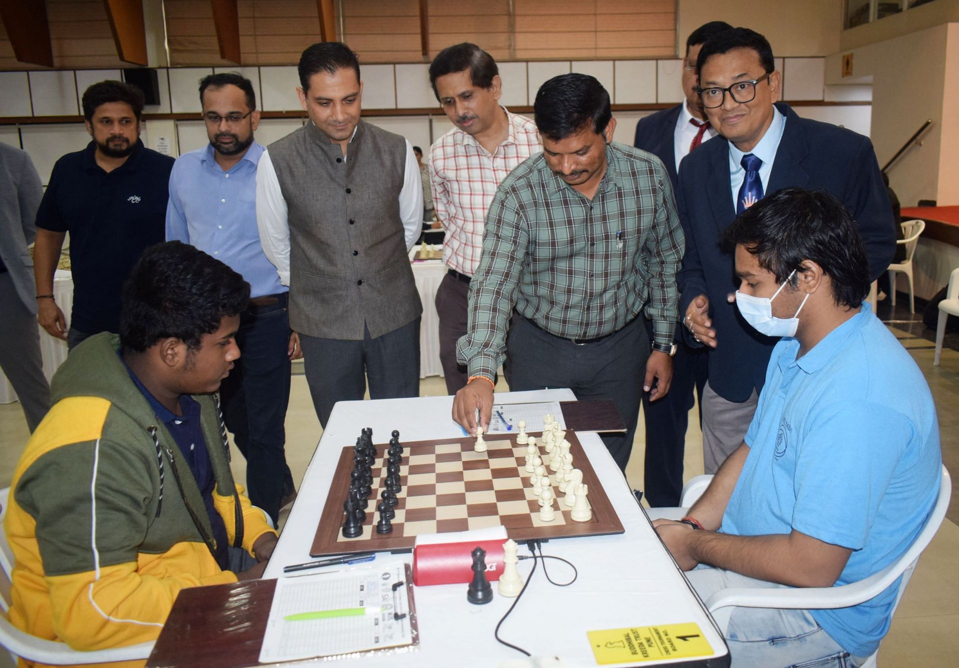 Deputy Director of Maharashtra Sports Navnath Fartade makes a move to mark the inauguration of the MPL 51st National Junior Chess Championships at the PYC Hindu Gymkhana in Pune on Tuesday. (Pic credit: MCA)