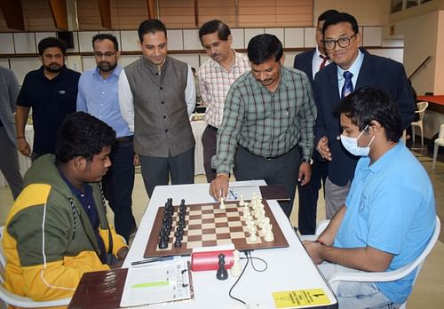 Deputy Director of Maharashtra Sports Navnath Fartade makes a move to mark the inauguration of the MPL 51st National Junior Chess Championships at the PYC Hindu Gymkhana in Pune on Tuesday. (Pic credit: MCA)