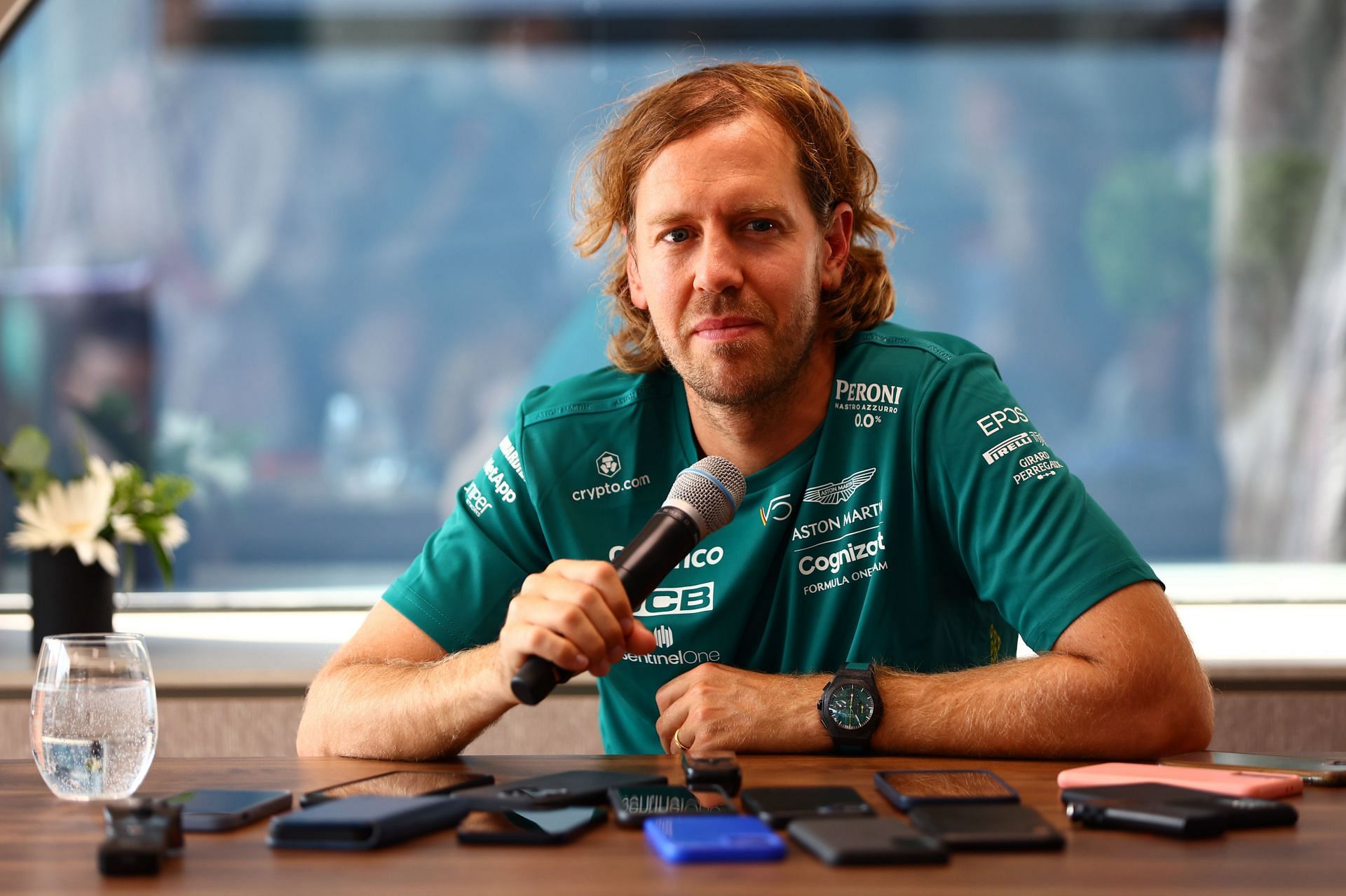 Sebastian Vettel talks to the media in the Paddock during previews ahead of the 2022 F1 Grand Prix of Hungary at Hungaroring (Photo by Mark Thompson/Getty Images)