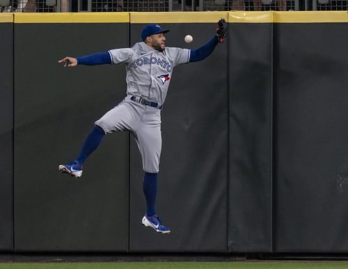 George Springer trying to make the play at the wall