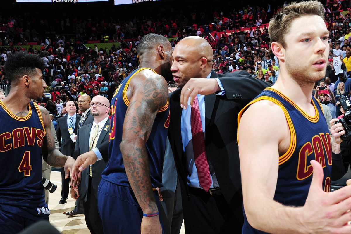 Darvin Ham and LeBron James embrace one another.