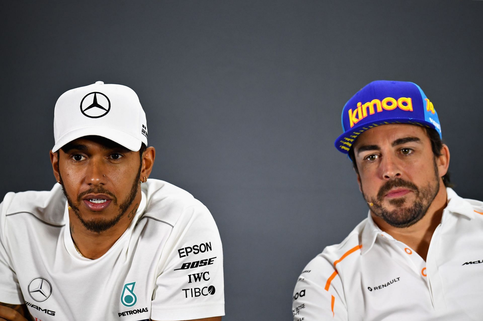Lewis Hamilton (left) and Fernando Alonso (right) speak to the media in a press conference during the 2018 F1 Abu Dhabi GP weekend (Photo by Clive Mason/Getty Images)