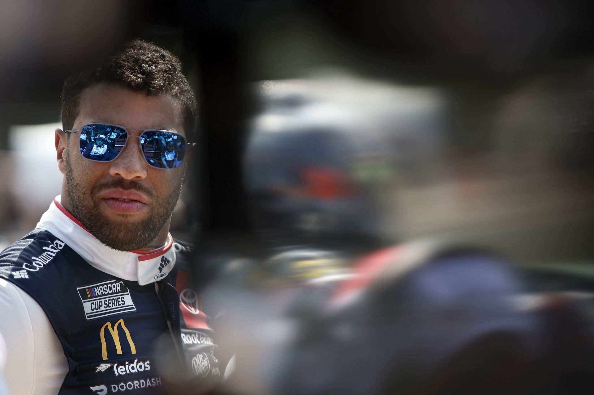 Bubba Wallace Jr. looks on during practice for the 2022 NASCAR Cup Series Kwik Trip 250 at Road America in Elkhart Lake, Wisconsin. (Photo by Sean Gardner/Getty Images)