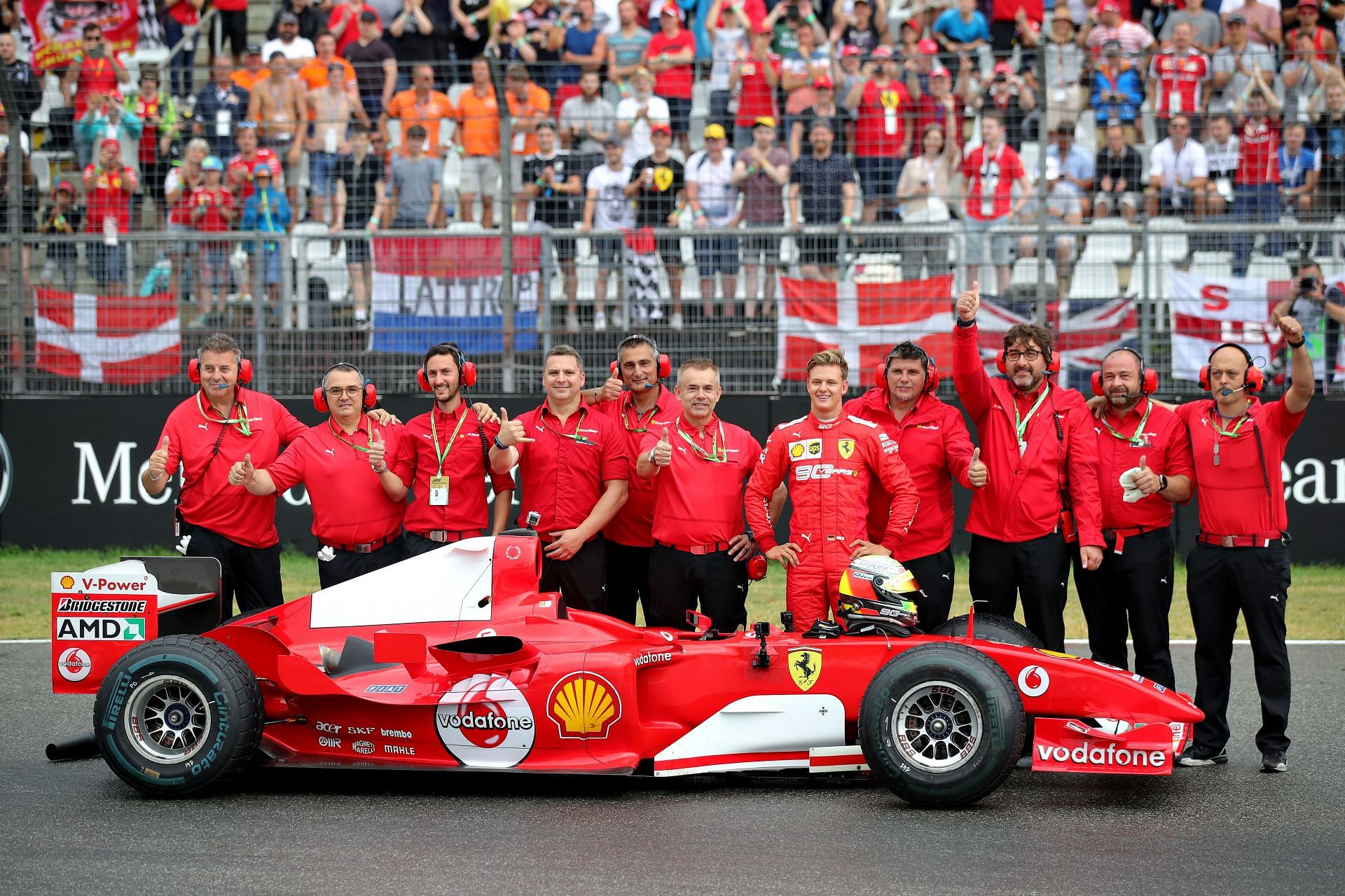 F1 Grand Prix of Germany - Mick Schumacher (5th from right) drives his father&#039;s championship-winning Ferrari