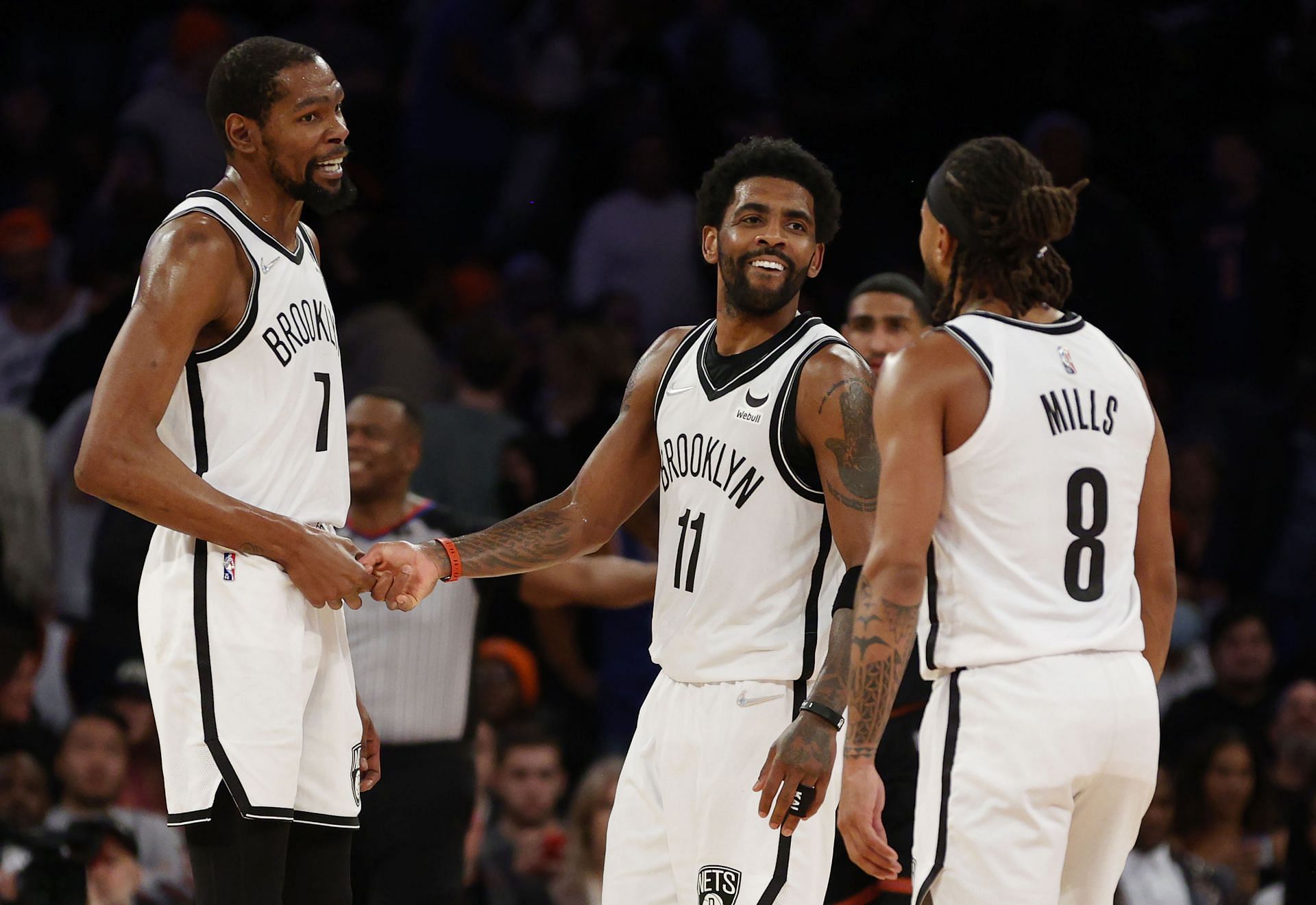 Kevin Durant (left), Kyrie Irving (middle), and Patty Mills of the Brooklyn Nets