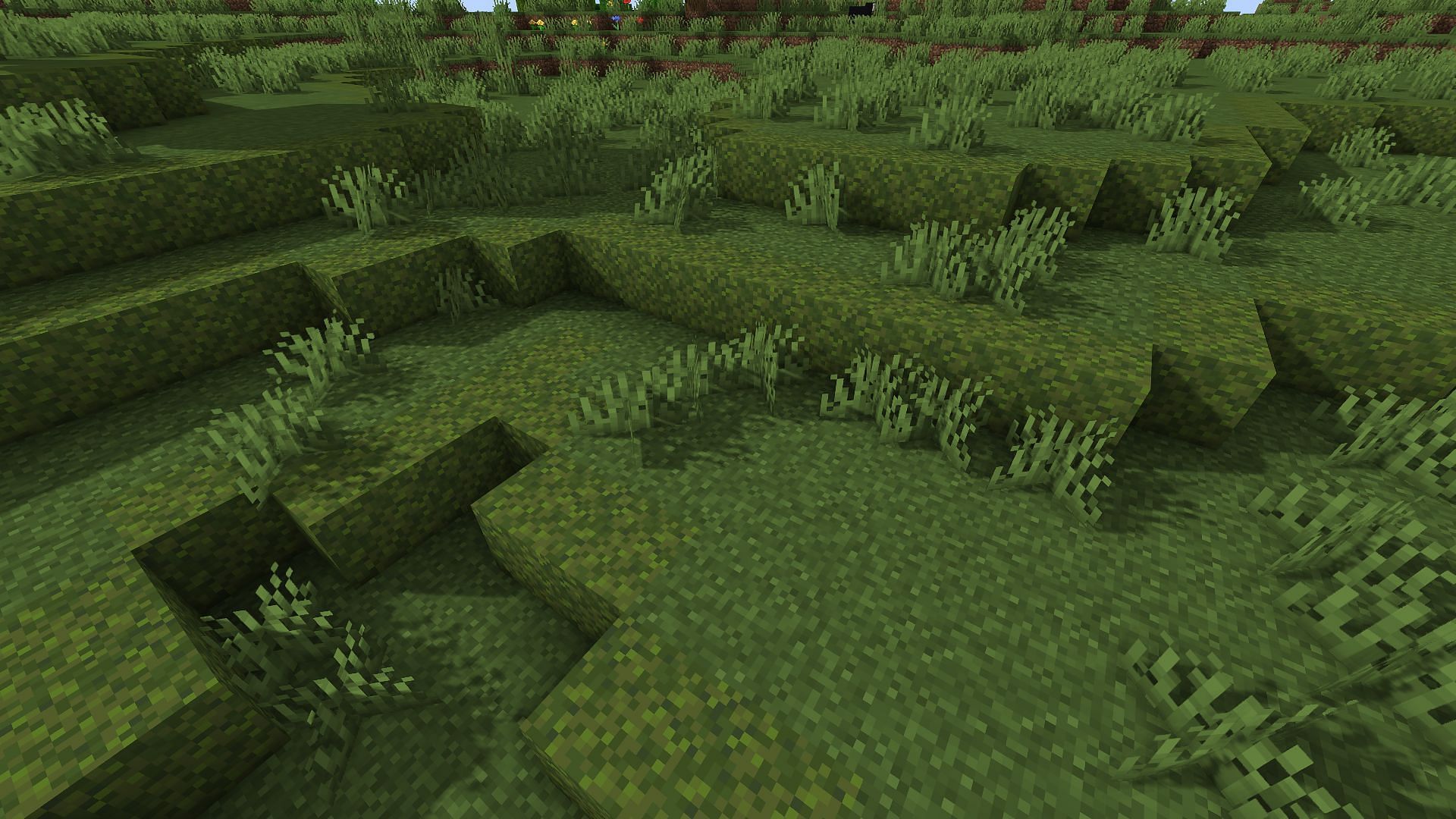 An example of a grassy hill made with moss blocks (Image via Minecraft)
