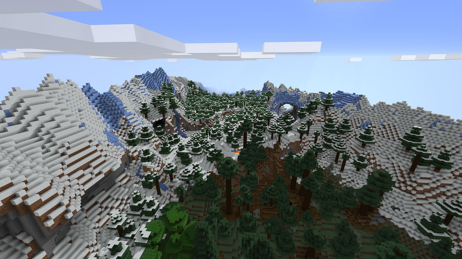 A valley found between two snowy peaks (Image via Minecraft)