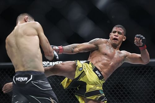 Gilbert Burns kicking Khamzat Chimaev at UFC 273: Volkanovski v The Korean Zombie Zombie (Image via Getty)