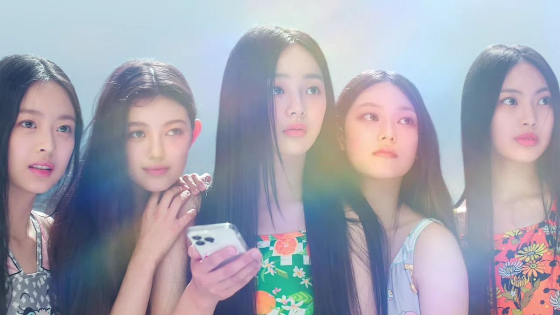 HYBE and ADOR&#039;s new five-member girl group, NewJeans (Image via YouTube/HYBE LABELS)