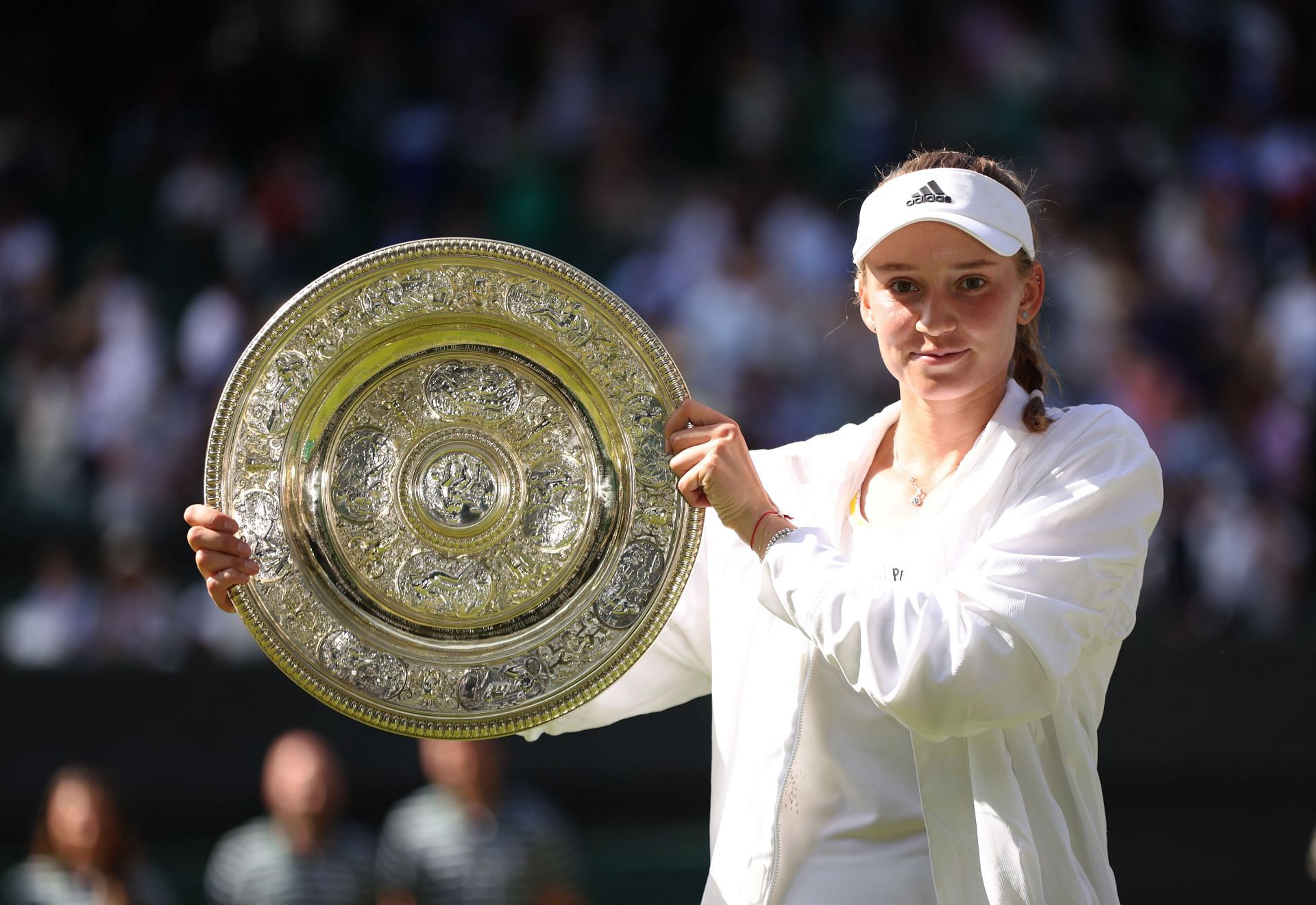 Elena Rybakina hoists aloft the Venus Rosewater Dish at Wimbledon on Saturday