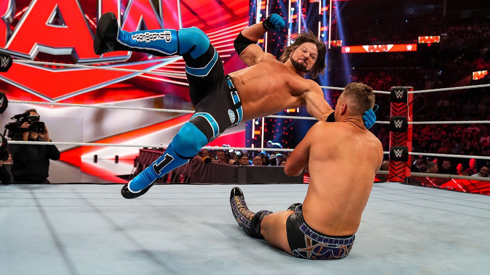 AJ Styles pummeling The Miz