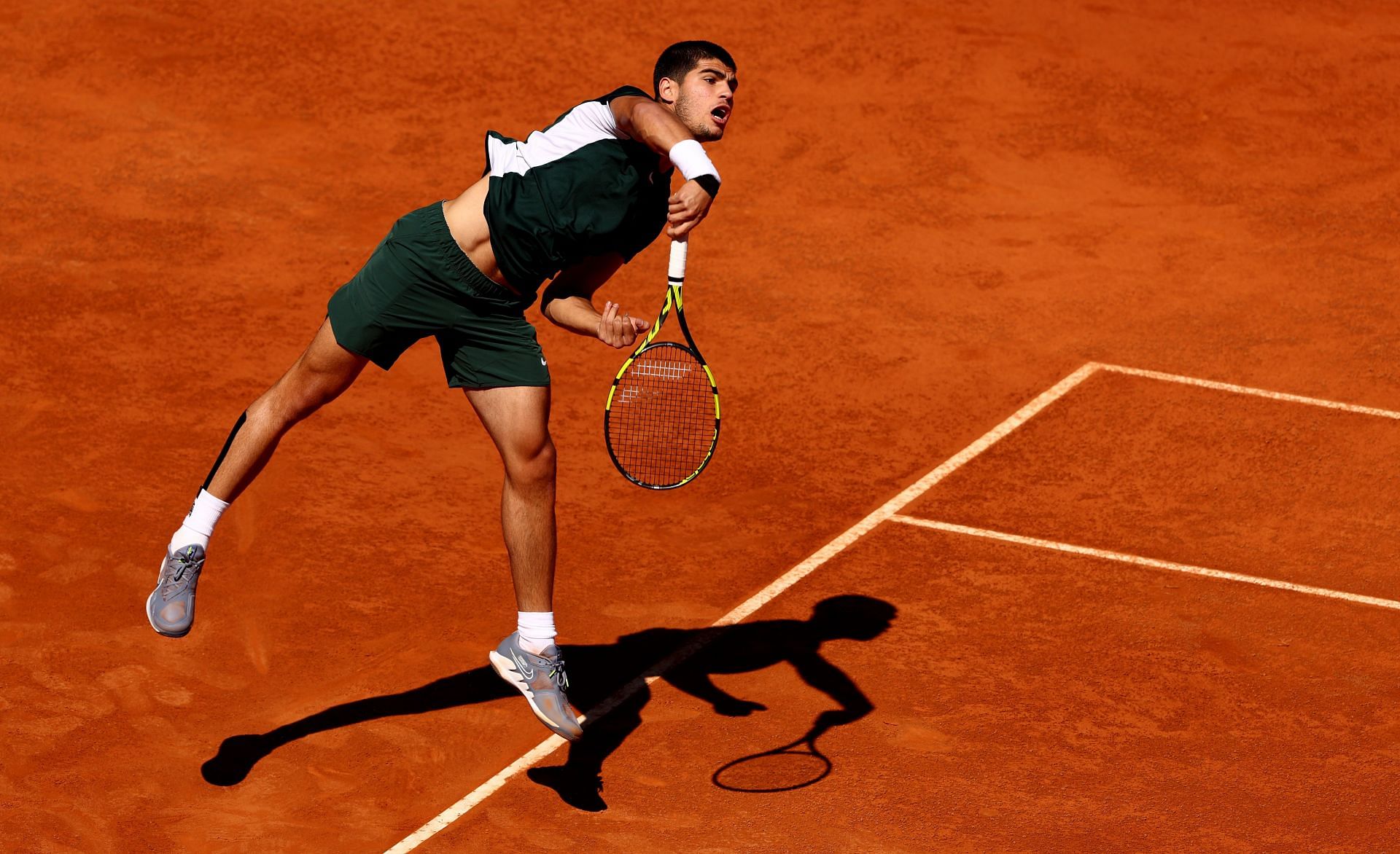 Carlos Alcaraz serving at the Mutua Madrid Open - Day Ten