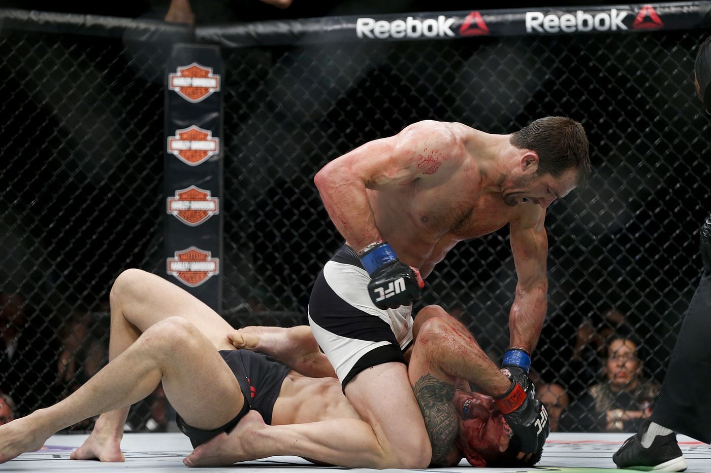 After missing a spinning wheel kick, Chris Weidman was battered by Luke Rockhold